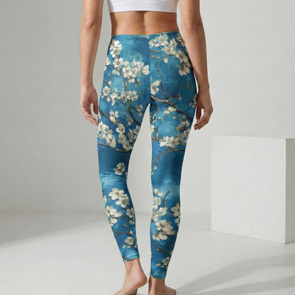 Person wearing blue floral leggings on a plain background