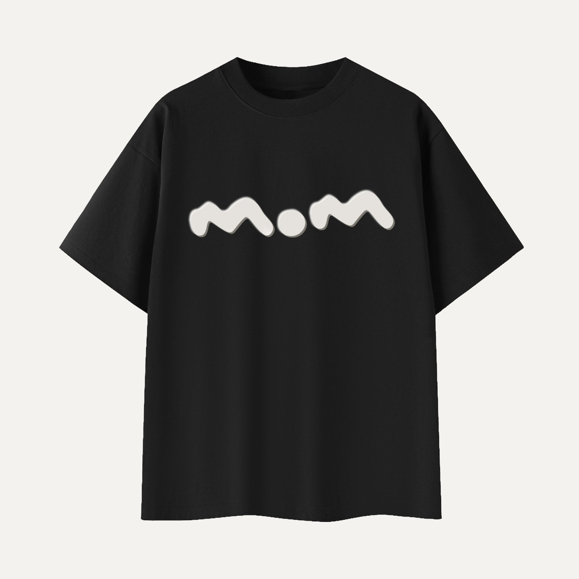 Black t-shirt with 'mom' printed in white on a light gray background