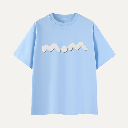 Light blue t-shirt with 'mom' printed on it against a light gray background