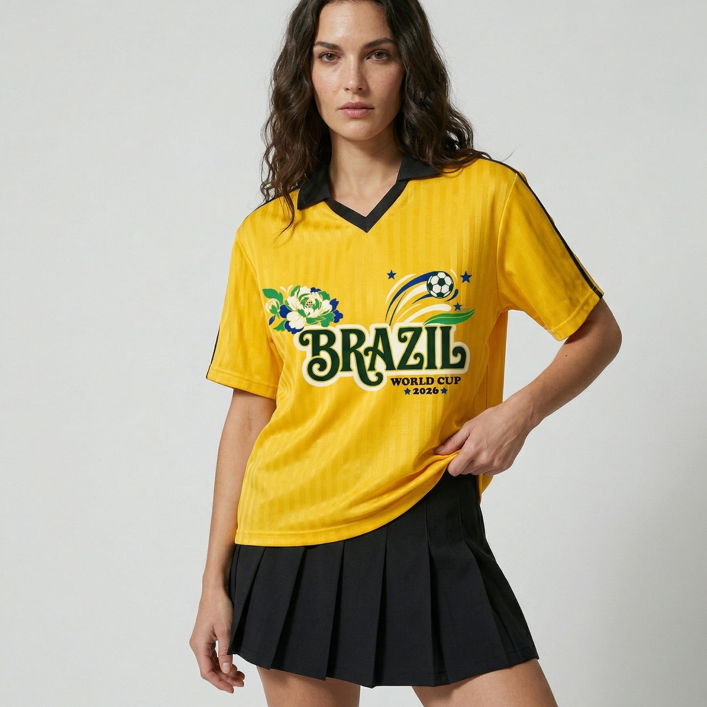 Woman wearing a yellow Brazil World Cup 2026 jersey with a black skirt on a light gray background