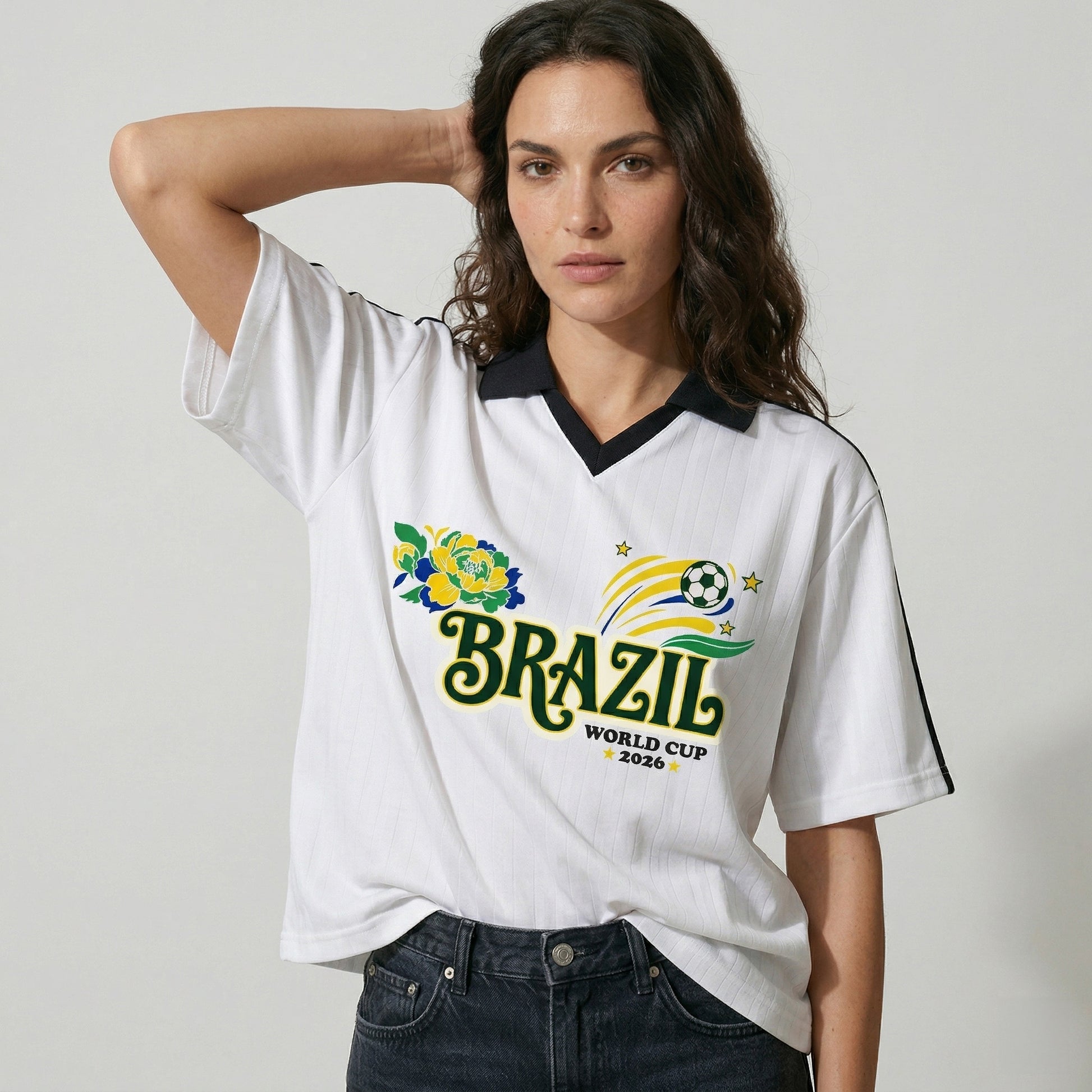 Woman wearing a white Brazil World Cup 2020 t-shirt with a floral design on a plain background