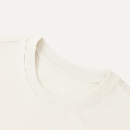 Close-up of a white shirt with a collar on a light beige background