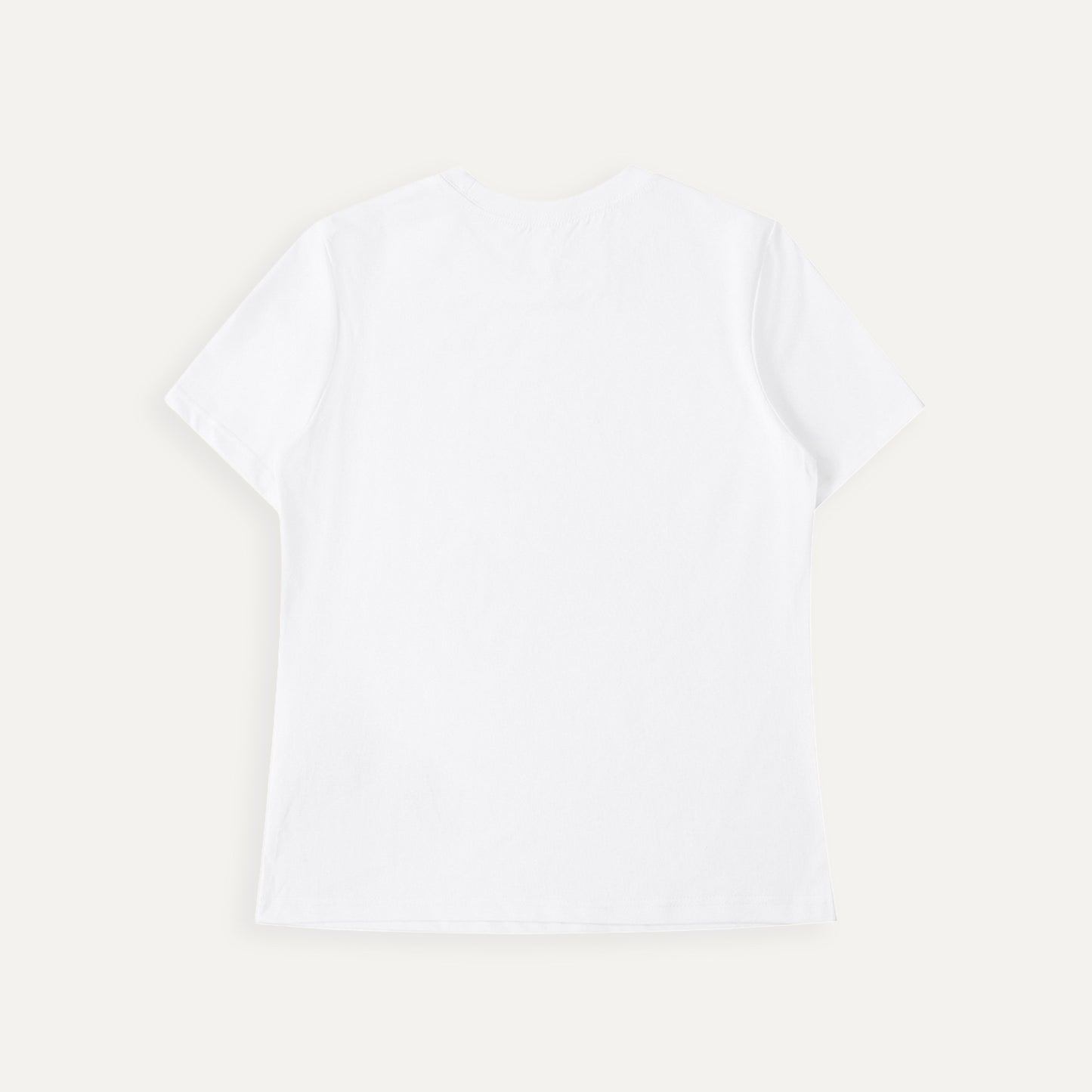 Plain white t-shirt on a light beige background