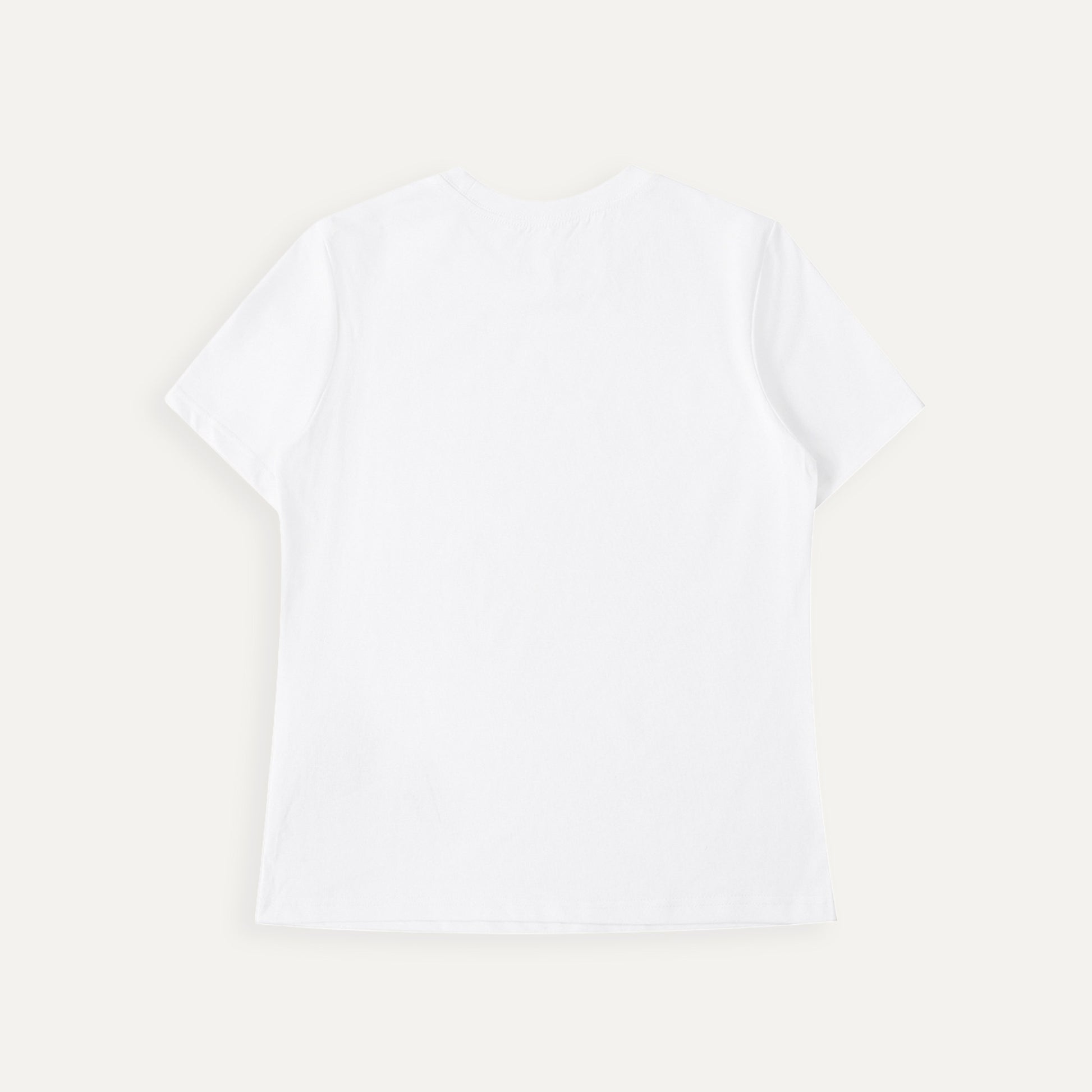 Plain white t-shirt on a light beige background