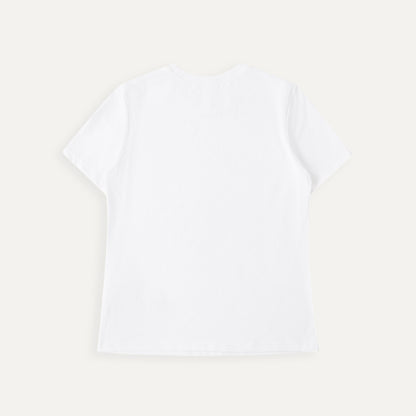 Plain white t-shirt on a light beige background