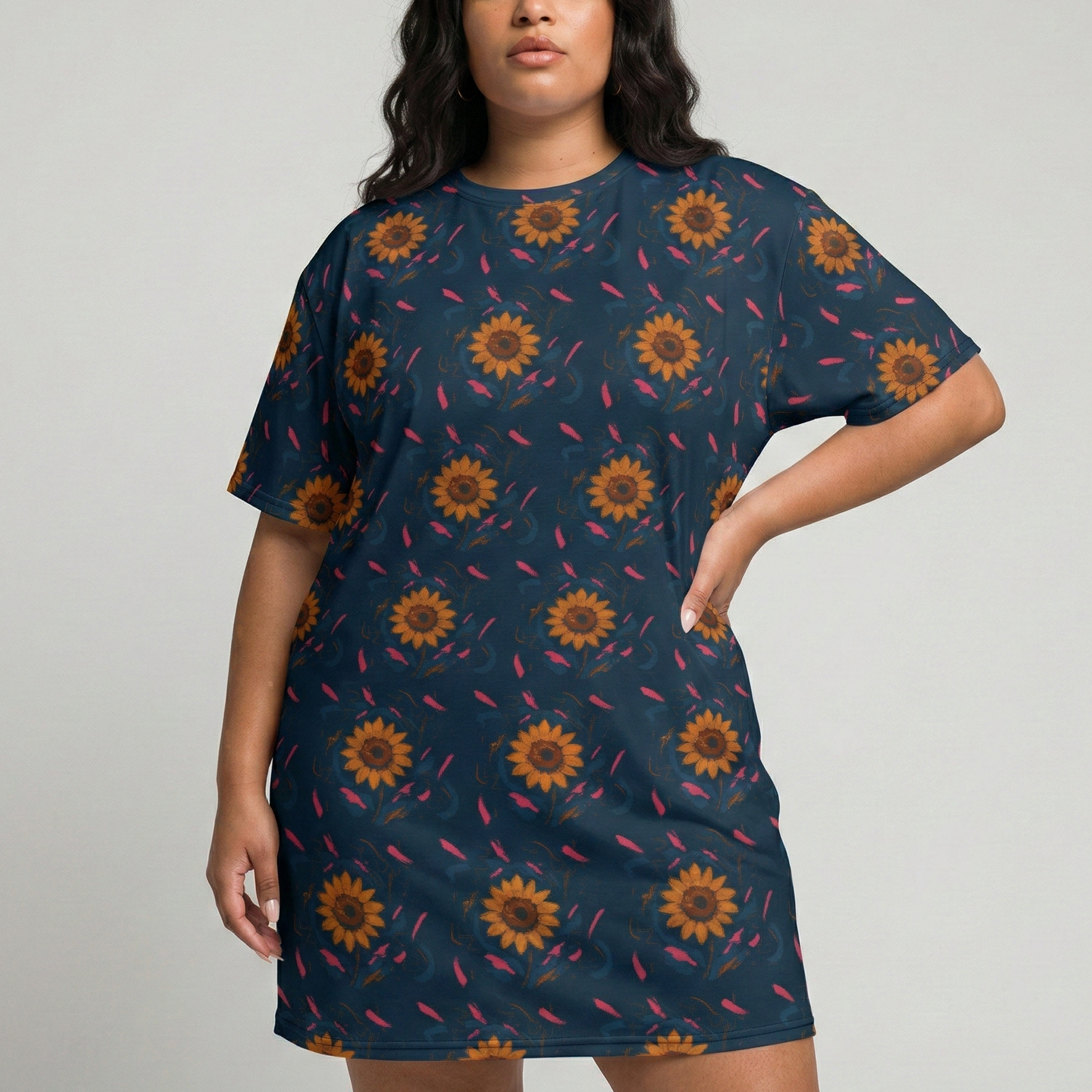 Woman wearing a navy dress with sunflower pattern on a plain background