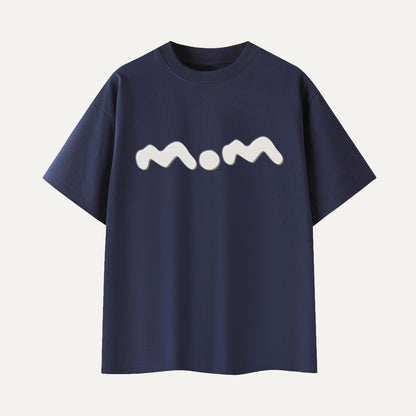 Navy blue t-shirt with 'mom' printed in white on a light gray background