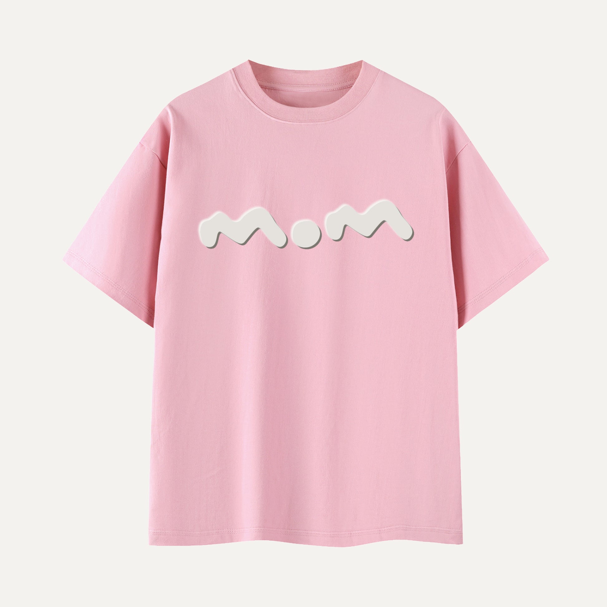 Pink t-shirt with 'Mom' printed on it against a white background