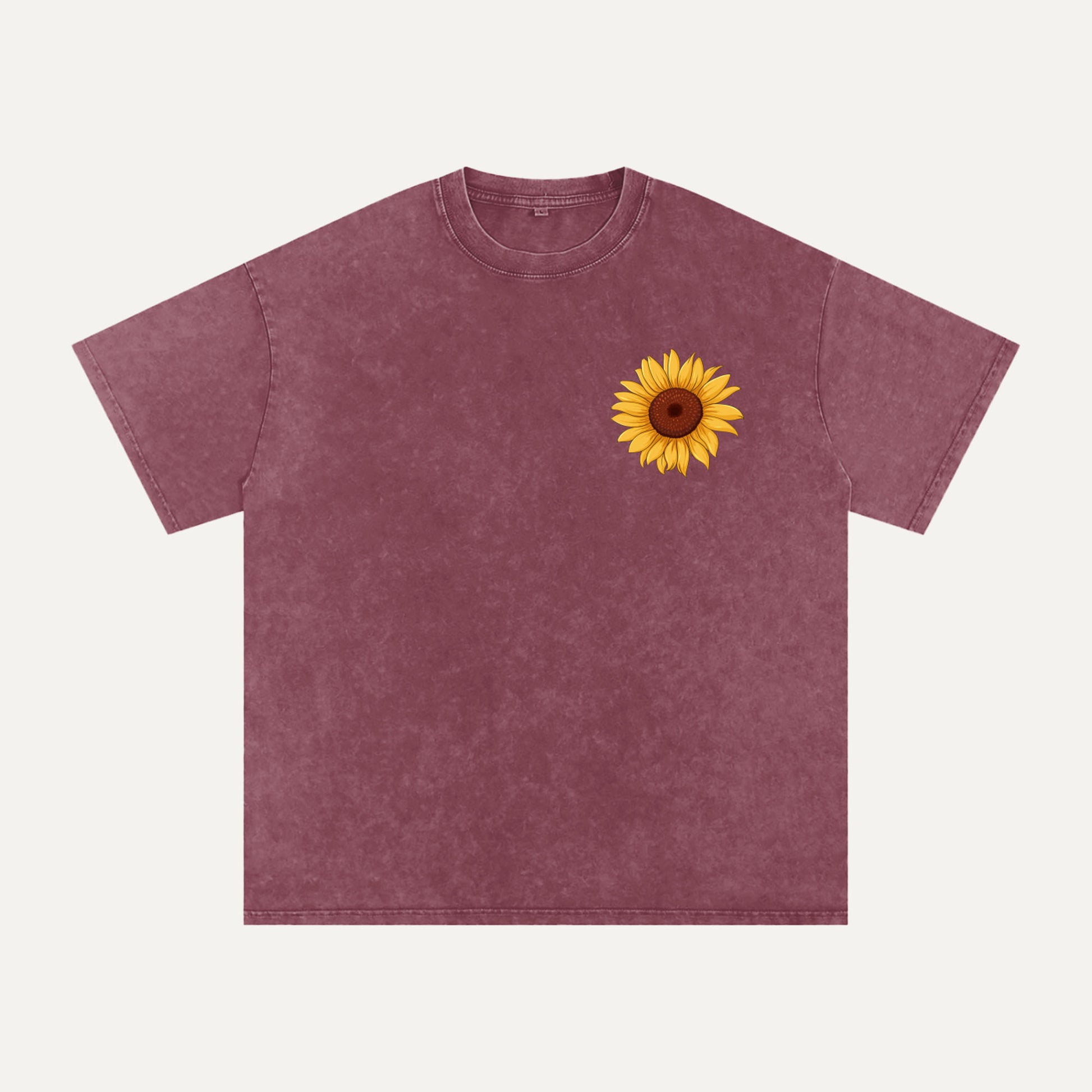 Maroon t-shirt with a sunflower design on a white background