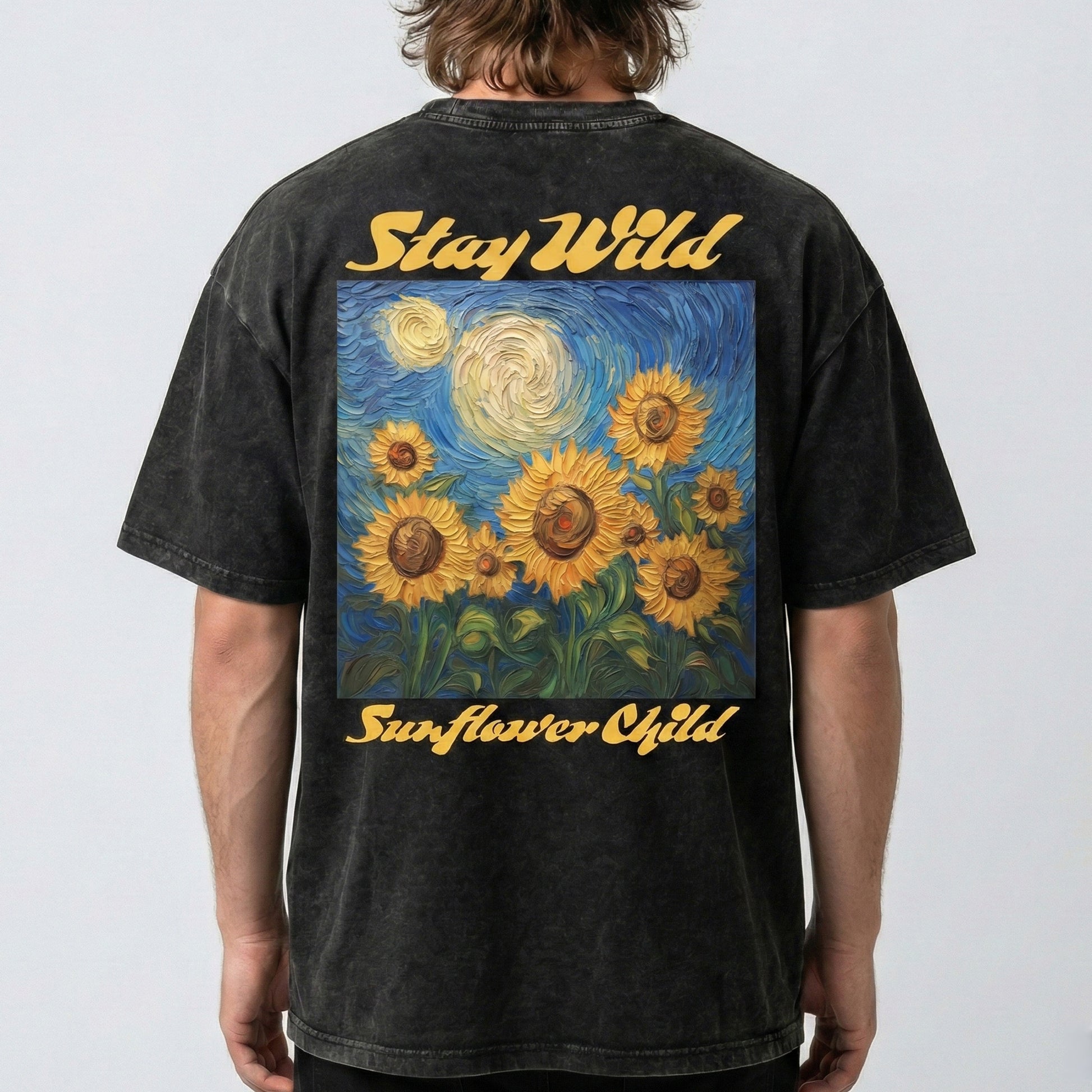 Person wearing a black t-shirt with sunflower design and 'Stay Wild Sunflower Child' text on a plain background