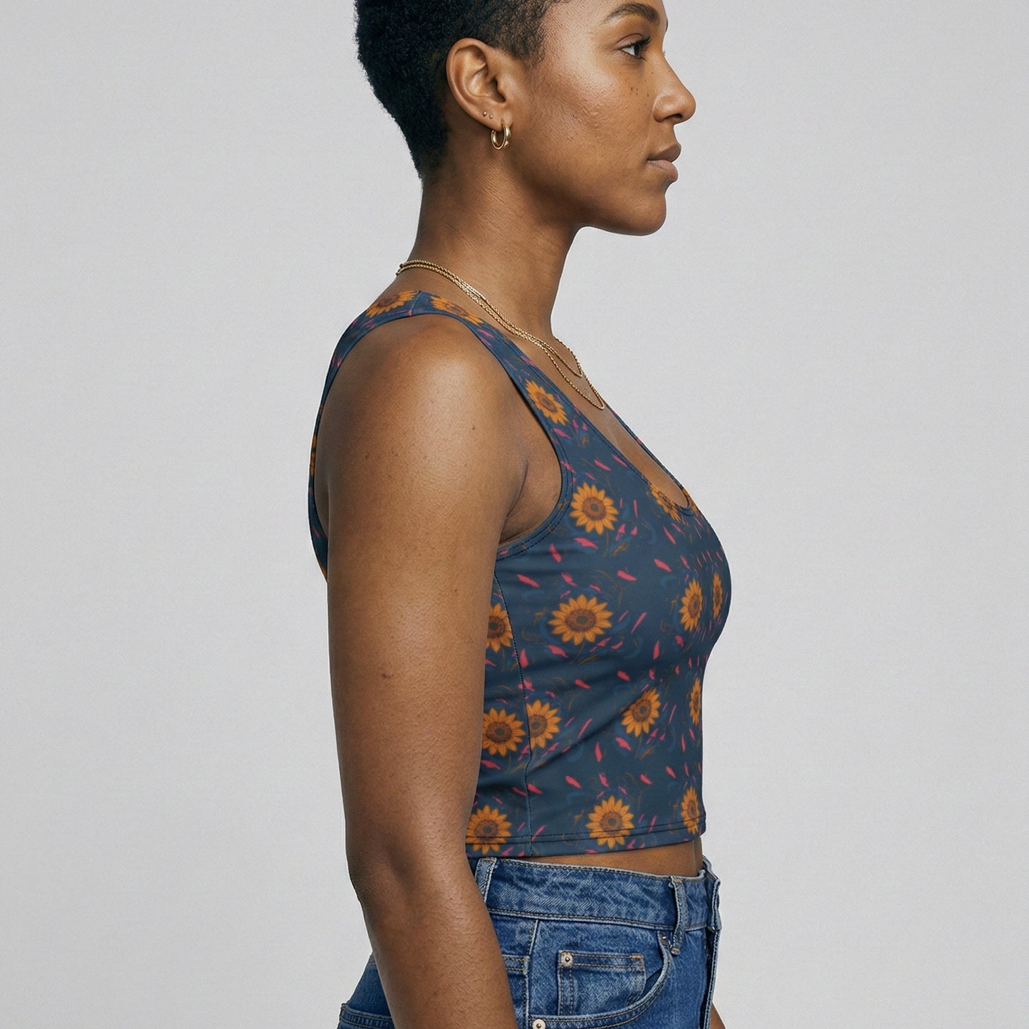 Woman wearing a blue floral top against a plain background