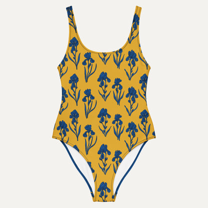 Yellow swimsuit with blue floral pattern on a white background