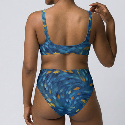 Person wearing a blue and yellow patterned bikini against a plain background
