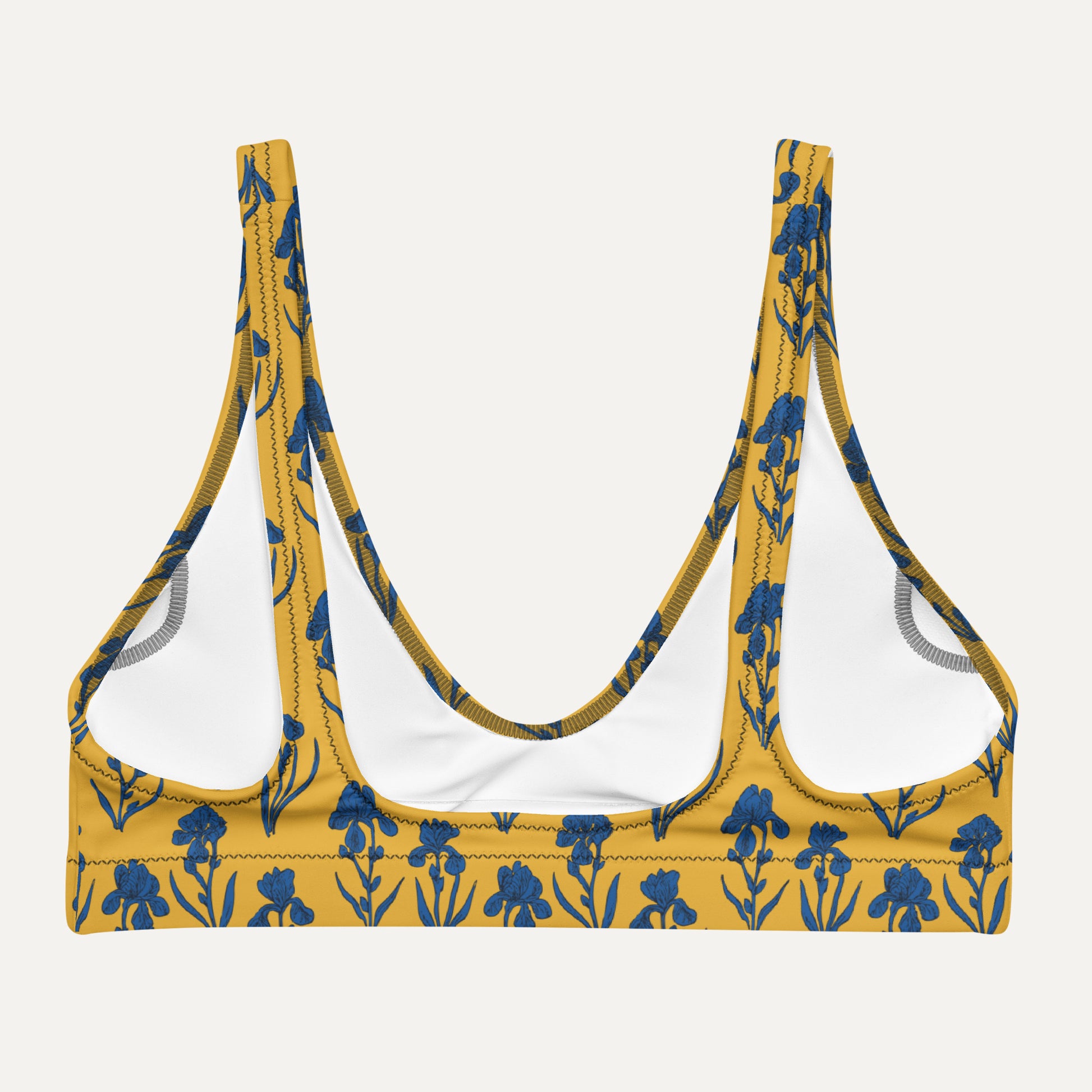 Yellow bikini top with blue floral pattern on a white background