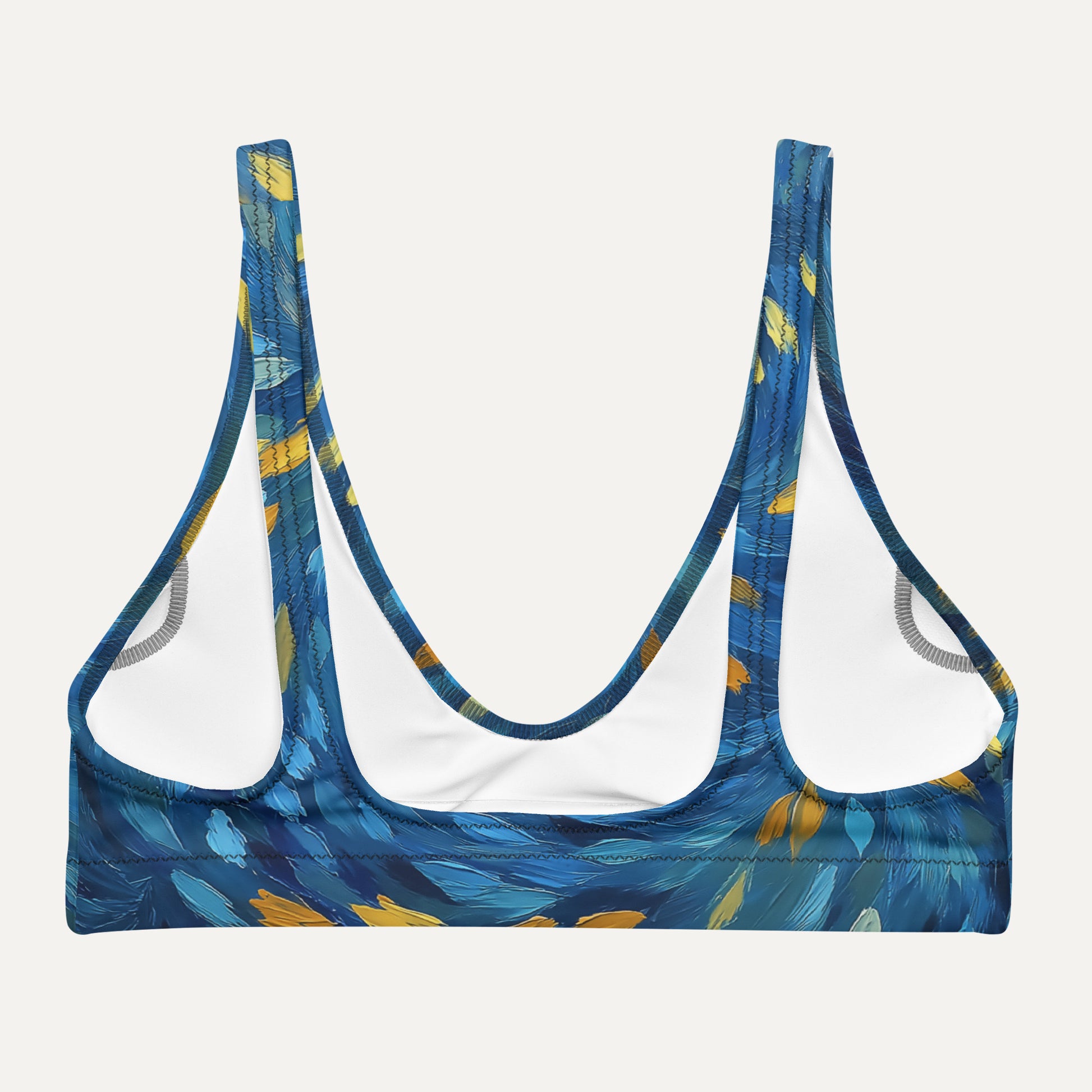 Blue patterned sports bra on a light gray background