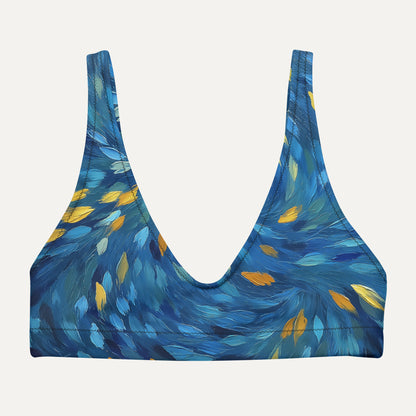 Blue patterned bikini top on a light gray background