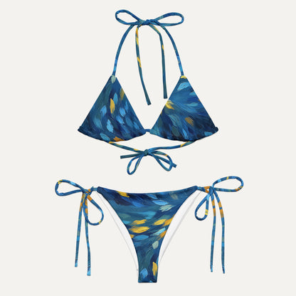 Blue and yellow patterned bikini set on a white background