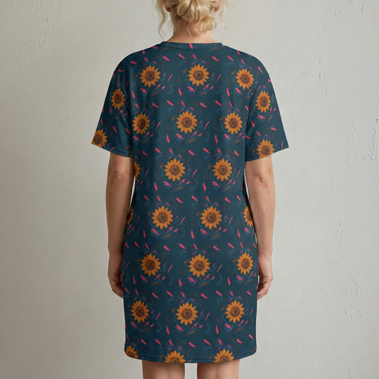 Person wearing a blue dress with sunflower pattern against a plain background