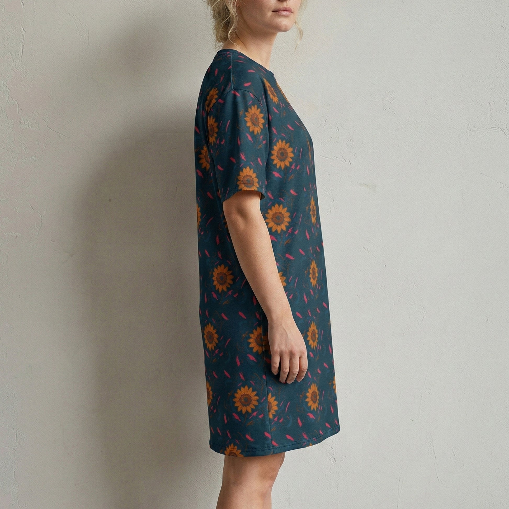 Woman wearing a patterned dress against a plain background