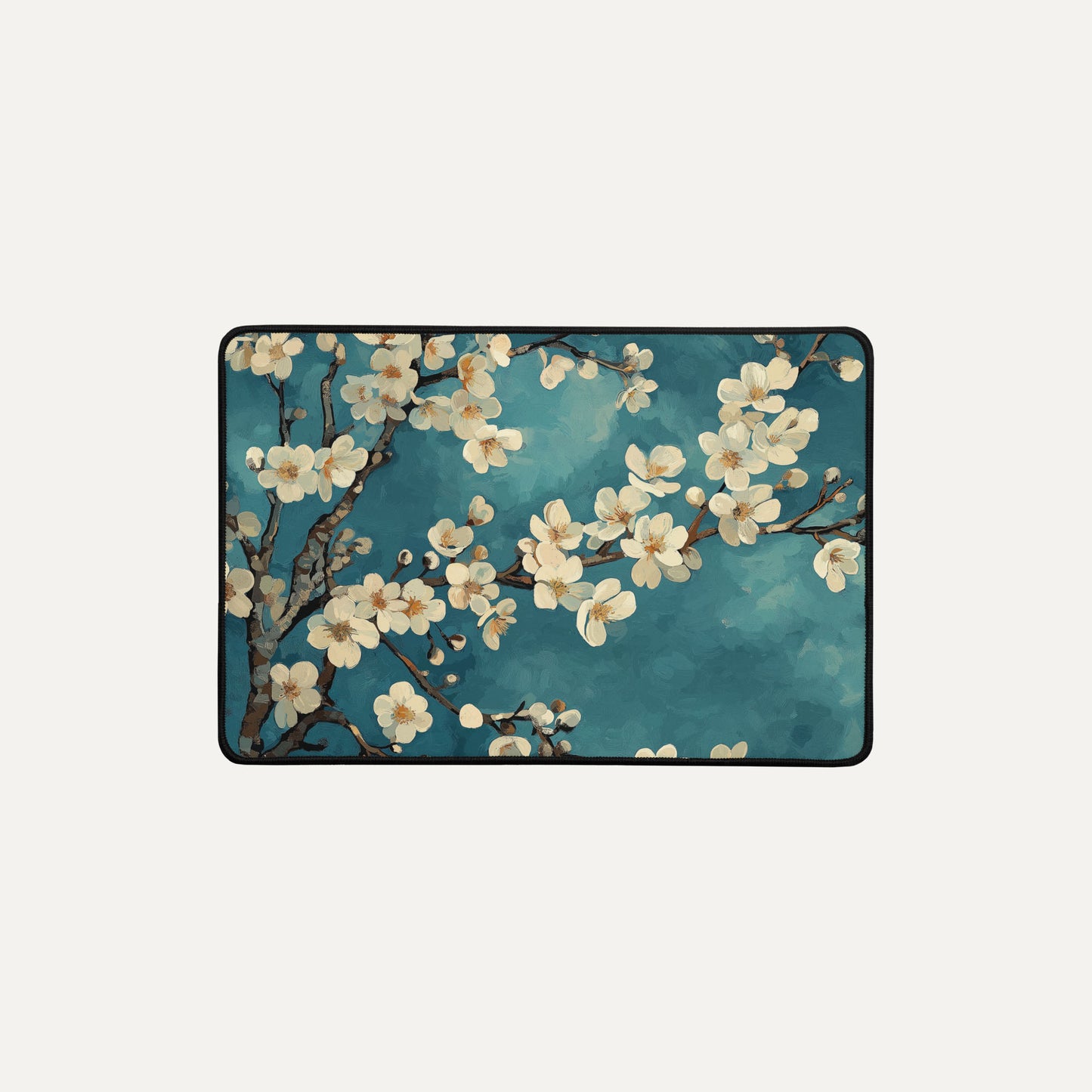 Laptop skin with cherry blossom design on a blue background
