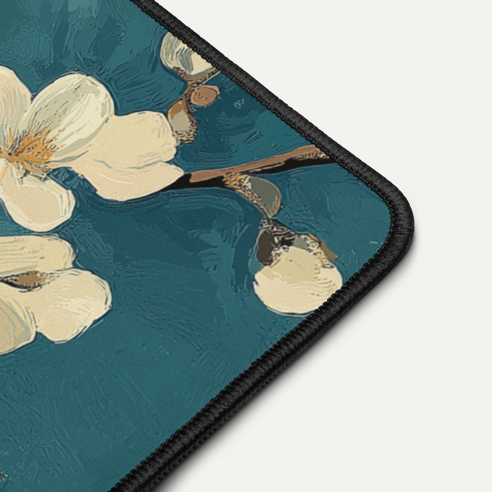 Floral design on a teal background with a black border