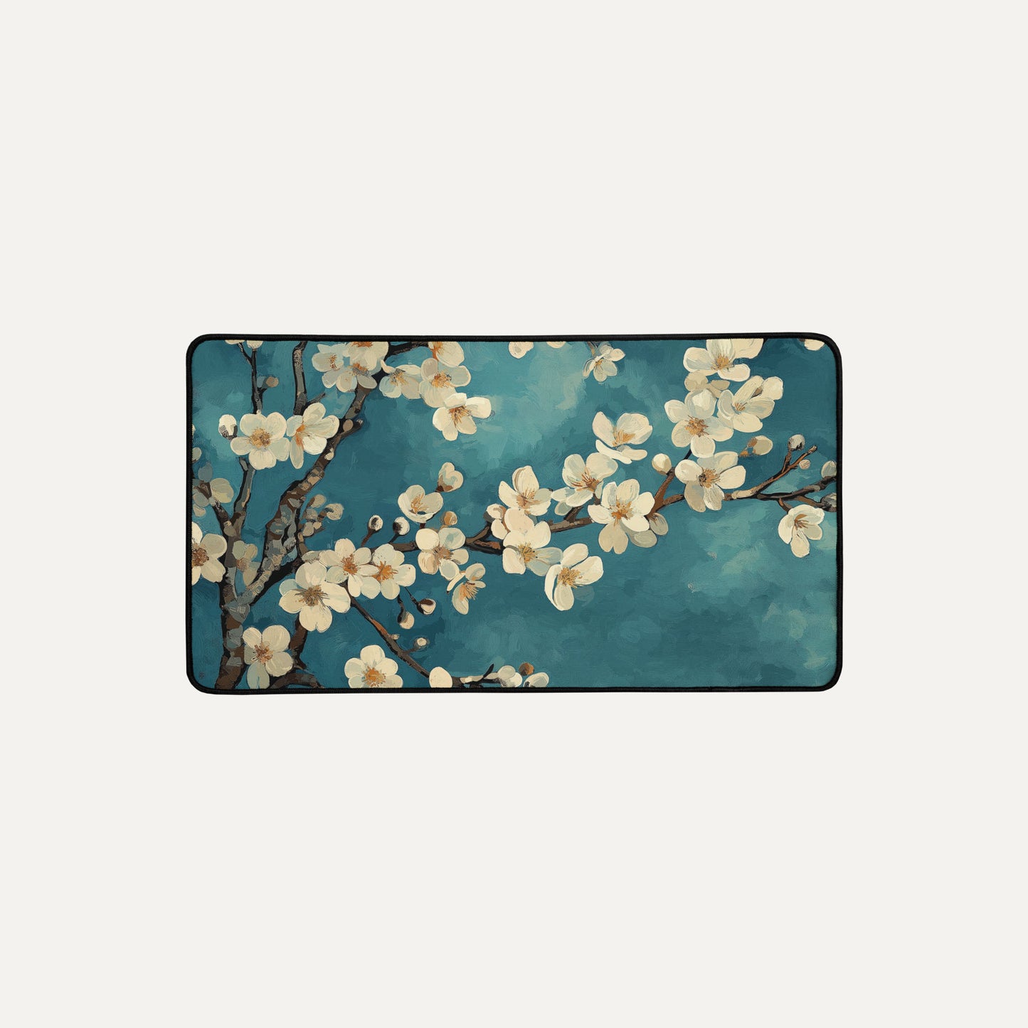 Desk mat with cherry blossom design on a teal background