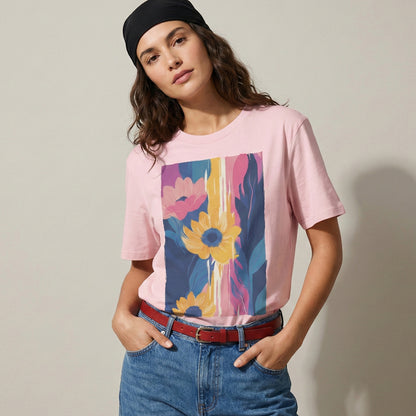 Person wearing a pink t-shirt with a colorful floral design, standing against a plain background.