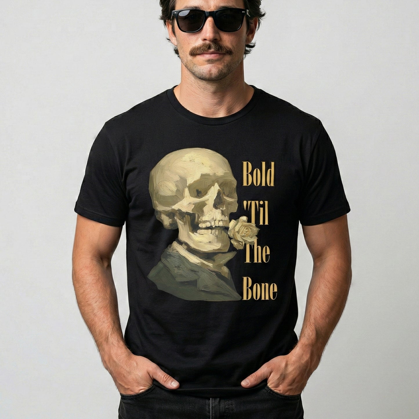 Man wearing a black t-shirt with a skull design and text on a plain background