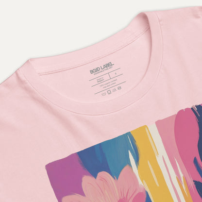 Pink t-shirt with colorful abstract design on a white background